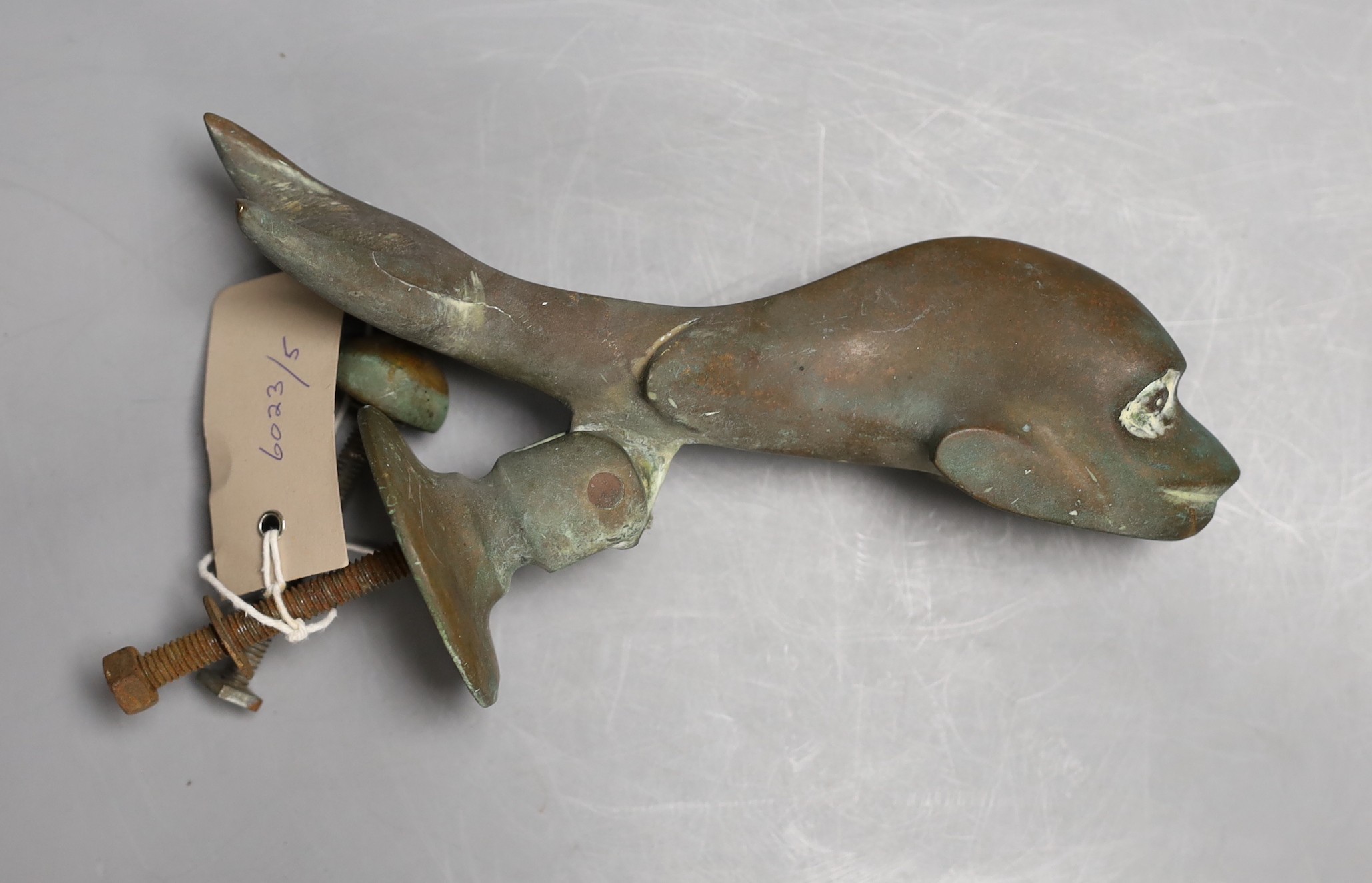 A Victorian cast bronze Dolphin door knocker, 21cms long.